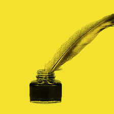 An ink bottle with a feathered ink pen